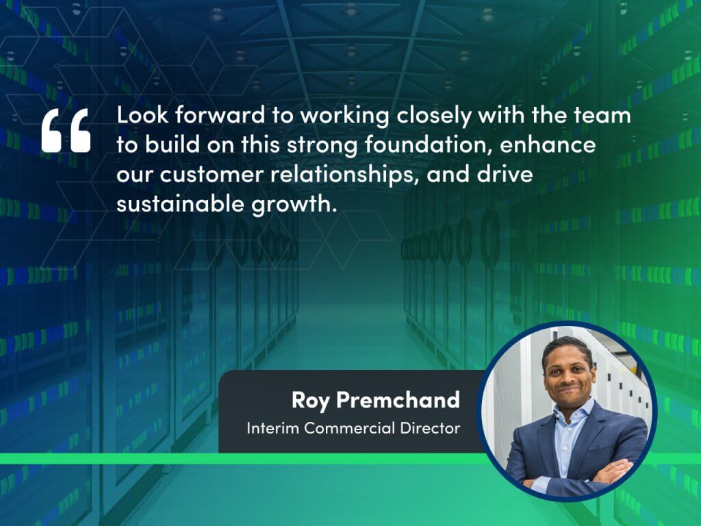 Promotional image featuring Roy Premchand, Interim Commercial Director, with a quote about enhancing customer relationships and driving sustainable growth, set against a backdrop of a server room