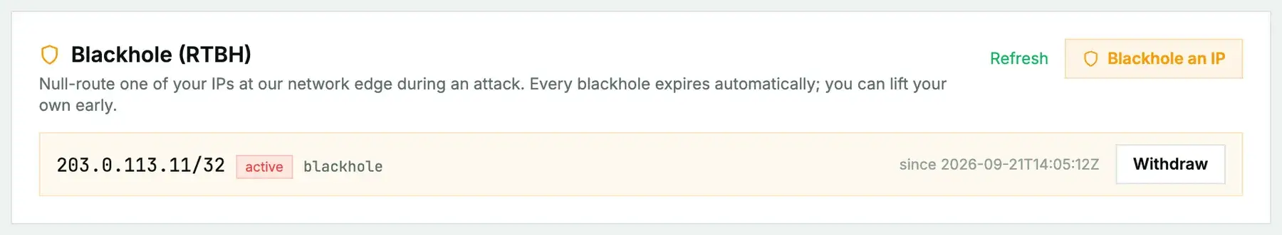 The Blackhole card with one active entry: 203.0.113.11/32, active, announced at a timestamp, with a Withdraw button